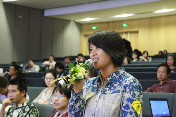 A journalist from CAFA ART INFO purposed her question at the conference .