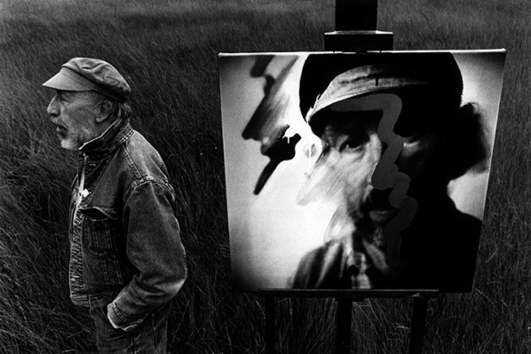 Hamilton in a field near his Henley home with a painting from his 1992 Tate show; Photograph John Reardon/The Guardian