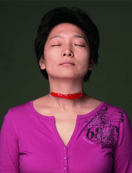 Teng Fei wears her design--That Summer. That Summer by Teng Fei, 2007-01;  silver and lacquer, diameter: 10cm