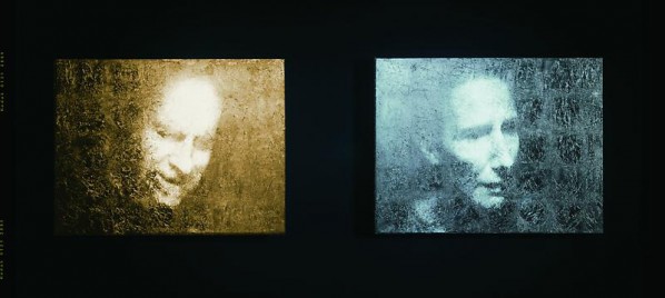 BILL VIOLA-Unspoken(Silver & Gold), 2001; Black-and-white video projected diptych on one gold and one silver-leaf panel mounted on wall, Overall dimensions 24 12 x 76 x 2 14 inches; 62.3 x 193 x 5.