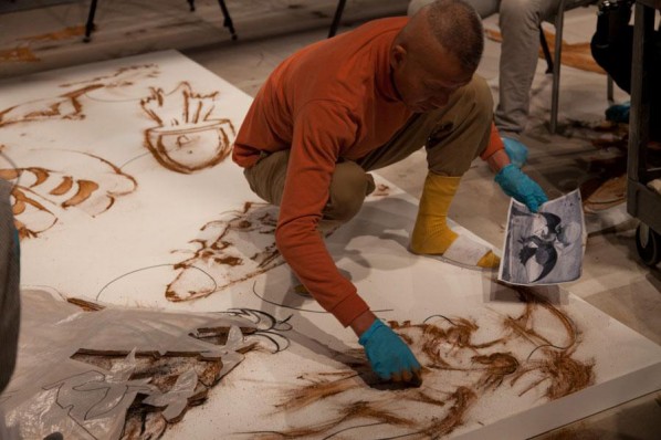 Cai Guo-Qiang sketching detail for gunpowder drawing Desire for Zero Gravity, Los Angeles, 2012