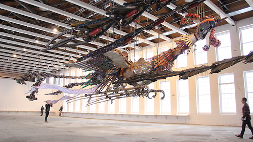 The internally illuminated 12-ton birds are suspended mid-air inside the museum’s football field-sized Building 5