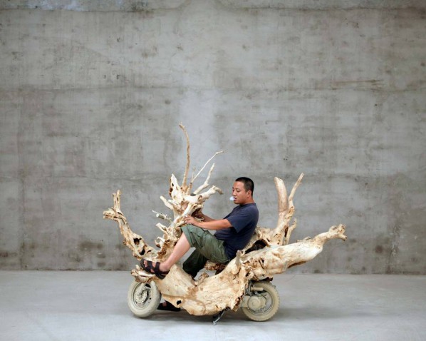 Artist Shi Jinsong on his reconstructed 'wooden' scooter, Beijing; Photo by Jason Florio Courtesy floriophoto.com